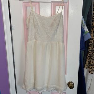 White dress with a floral lace detail on the top!